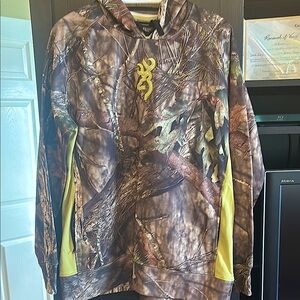 Camo Hoodie for Ladies.  Lightweight fleece lining.  100% polyester.